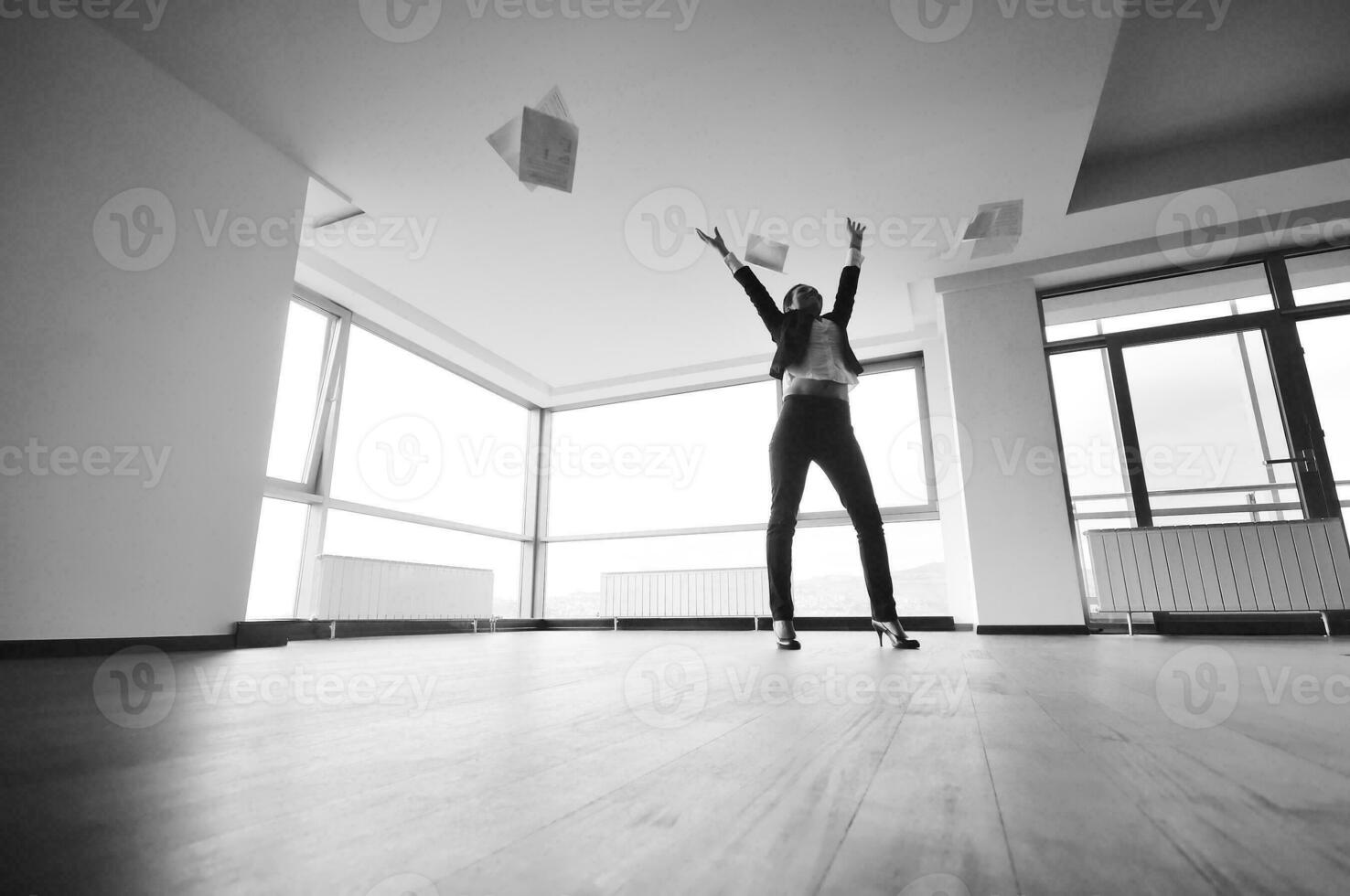 young business woman throw papers in air photo