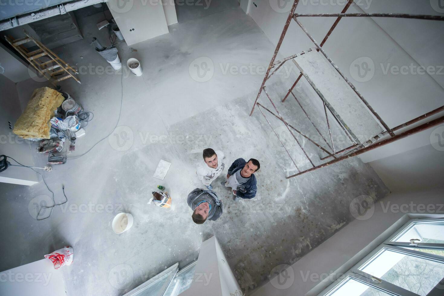 top view of Workers and builders with dirty uniform in apartment photo