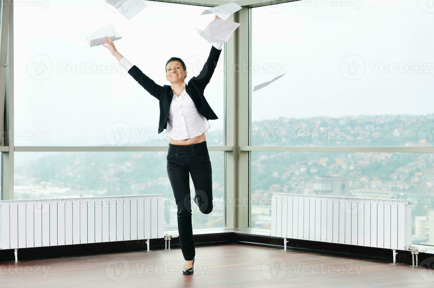 young business woman throw papers in air photo