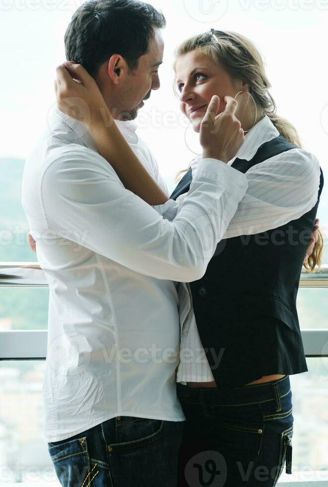 romantic happpy couple on balcony photo