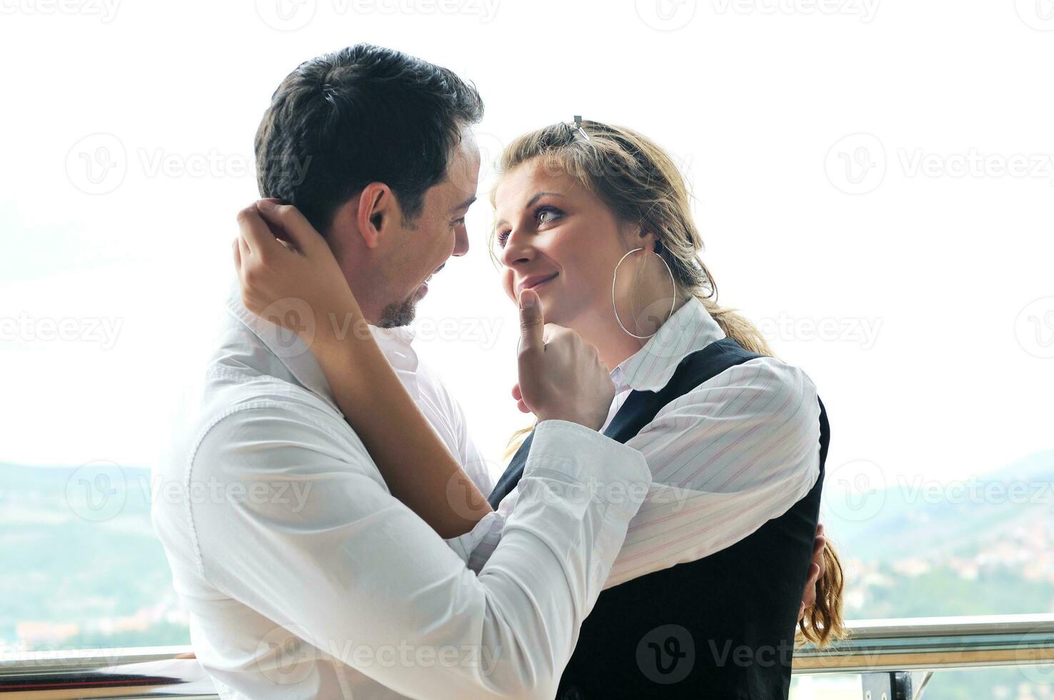 romantic happpy couple on balcony photo