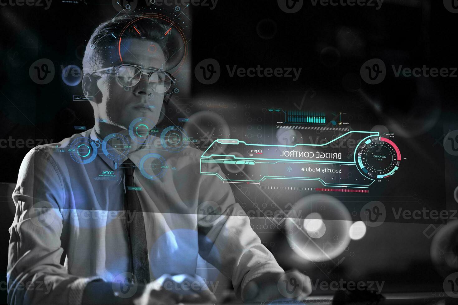 man working on computer in dark office photo