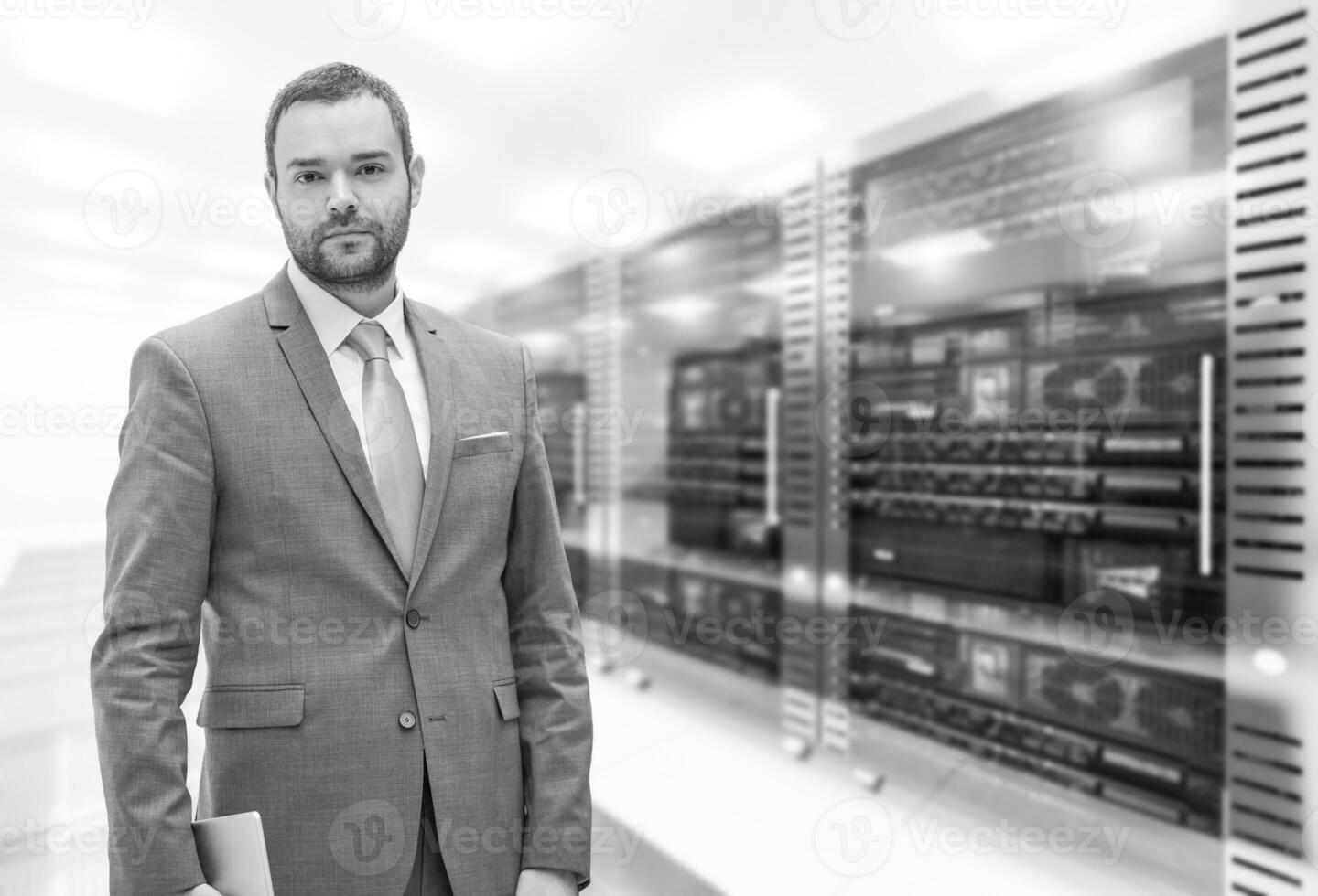 Young businessman in server room photo