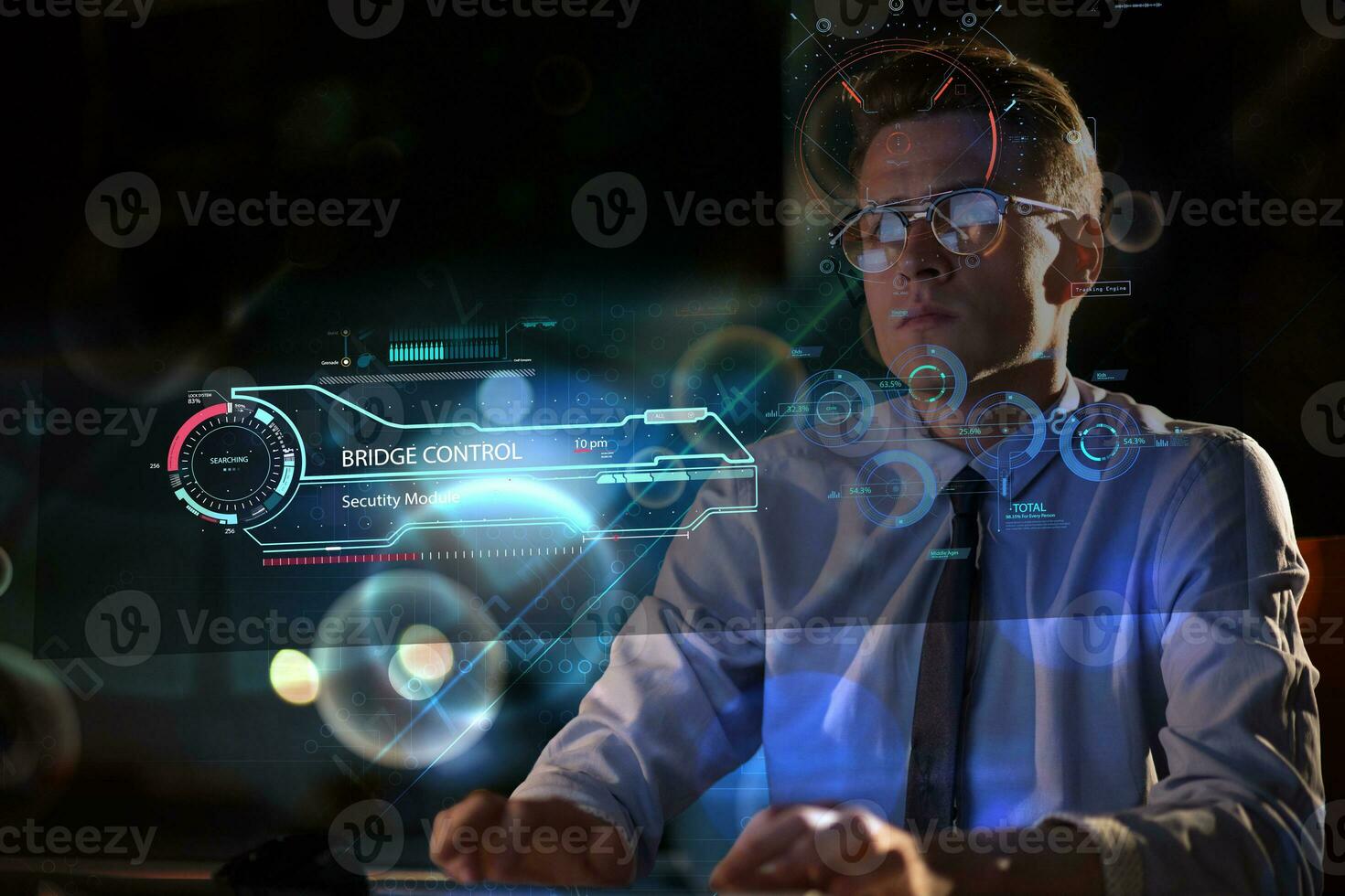 man working on computer in dark office photo