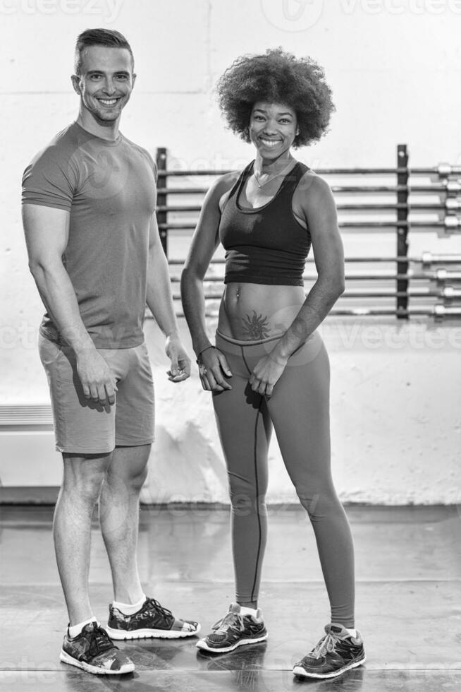 black woman after a workout at the gym with a trainer photo