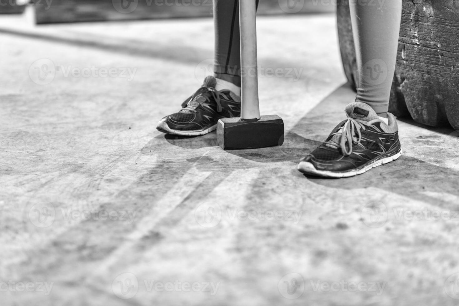 black woman after workout with hammer with focus on legs photo
