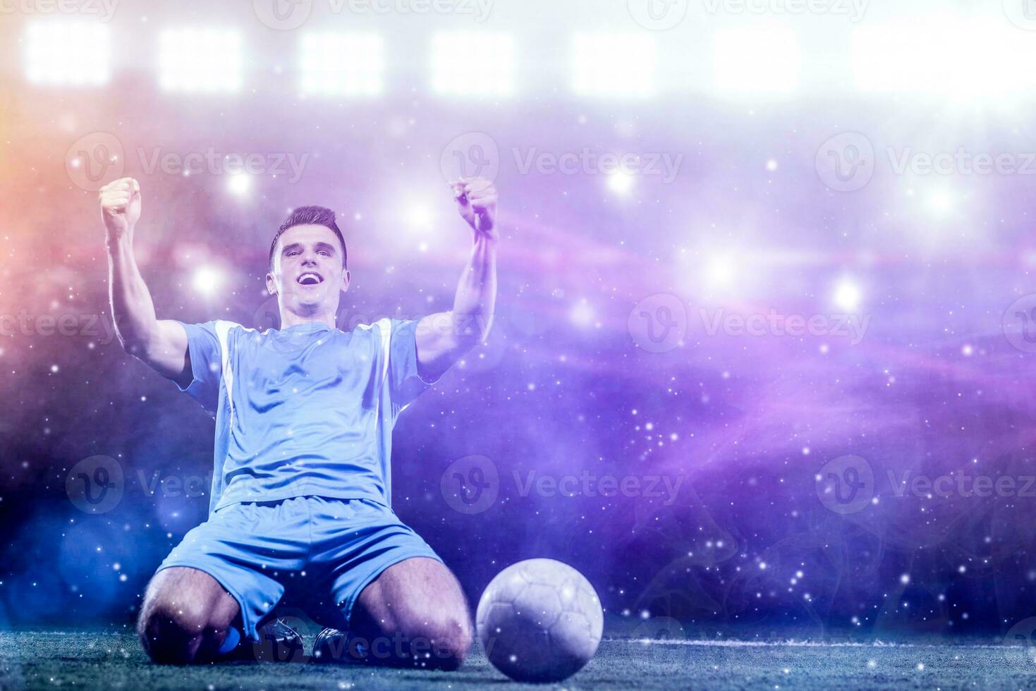 soccer player in front of big modern stadium with flares and lights photo