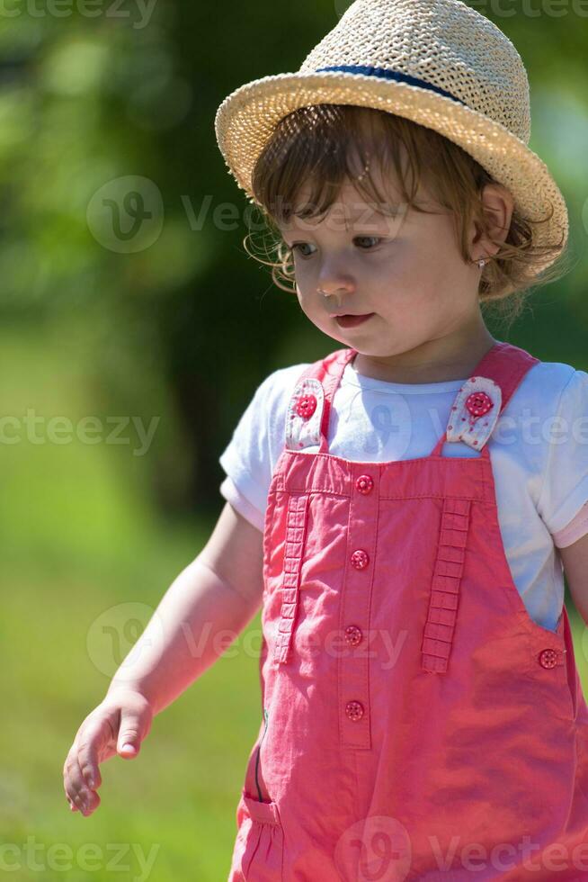 little girl runing in the summer Park photo