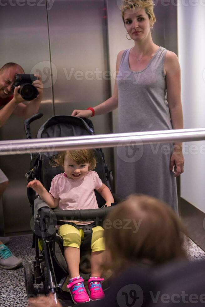 happy family in the elevator photo