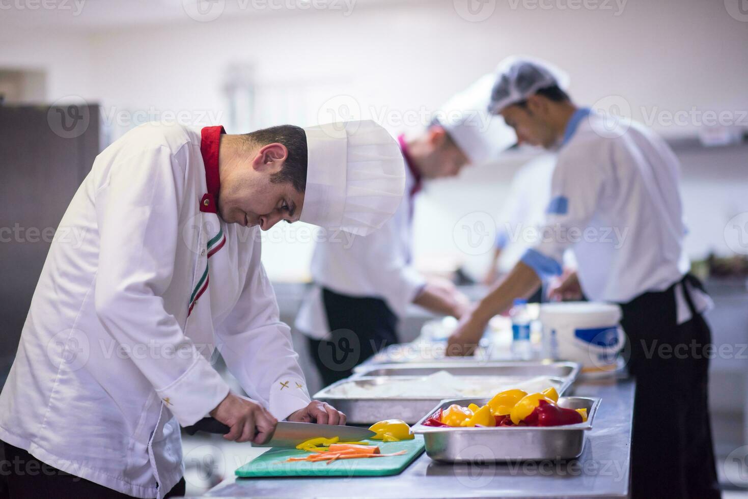 Chef cutting fresh and delicious vegetables photo