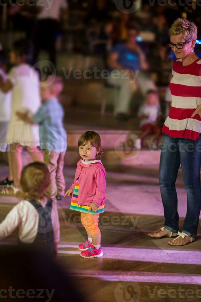 little girl dancing in the kids disco photo