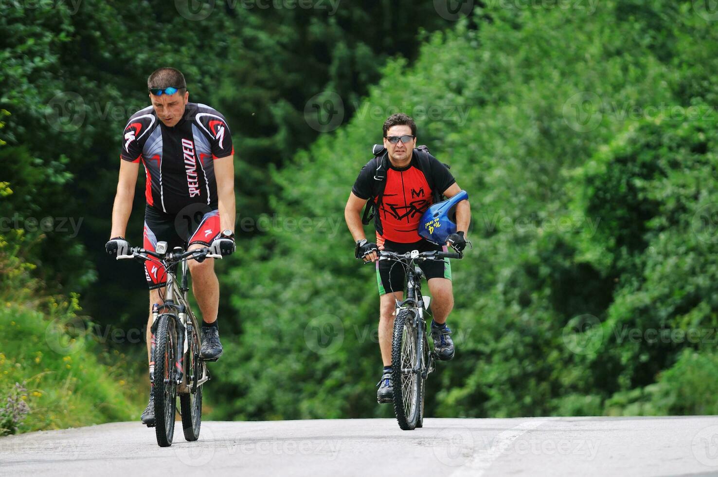 friendship and travel on mountain bike photo
