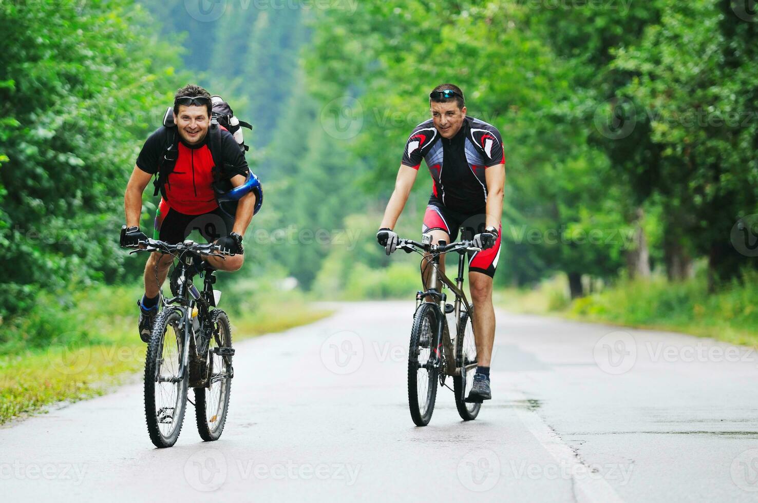 friendship and travel on mountain bike photo