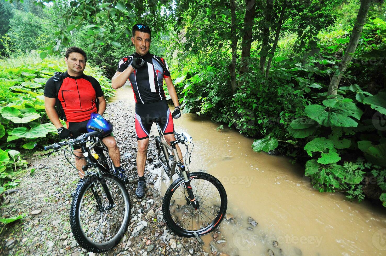 friendship and travel on mountain bike photo