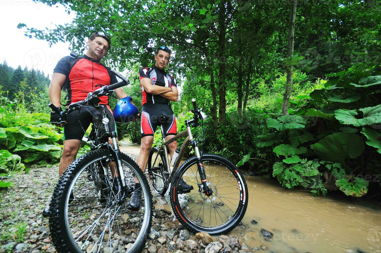 friendship and travel on mountain bike photo