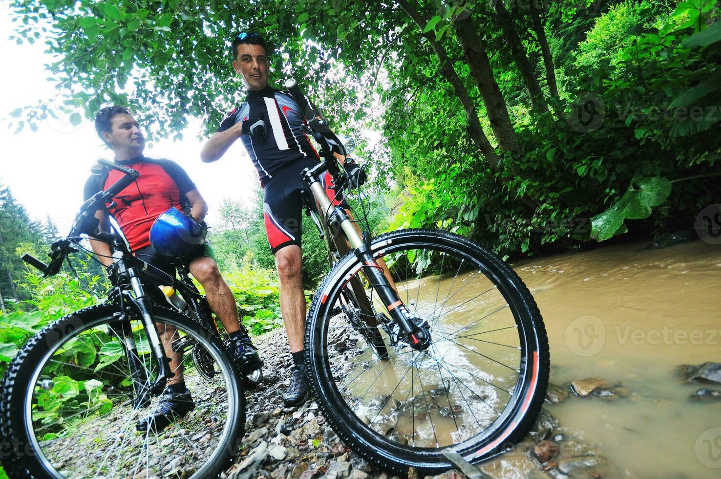 friendship and travel on mountain bike photo