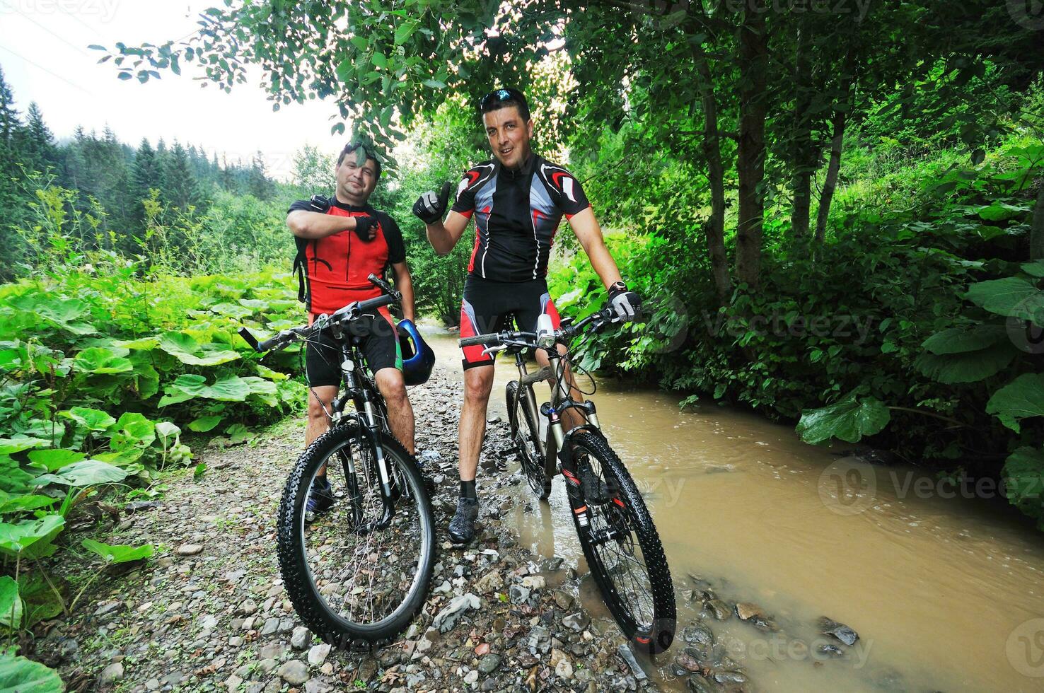 friendship and travel on mountain bike photo