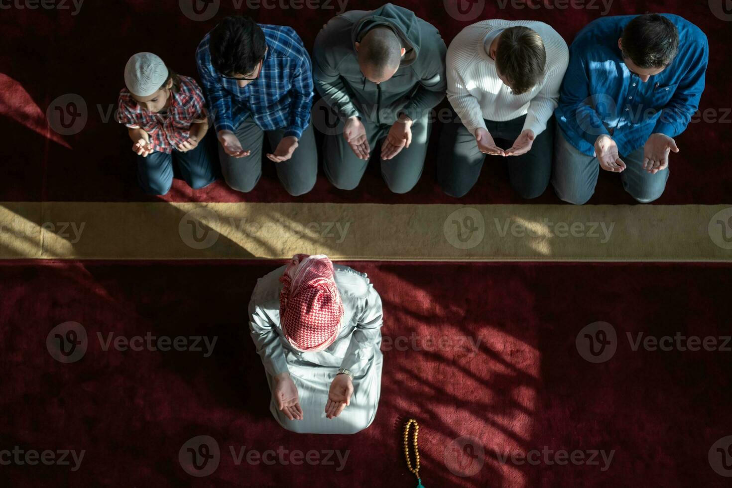 group of muslim people praying namaz in mosque. photo