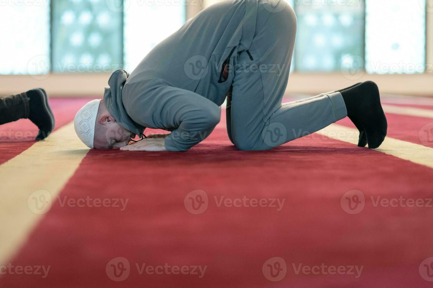 man performing sajdah in namaz photo
