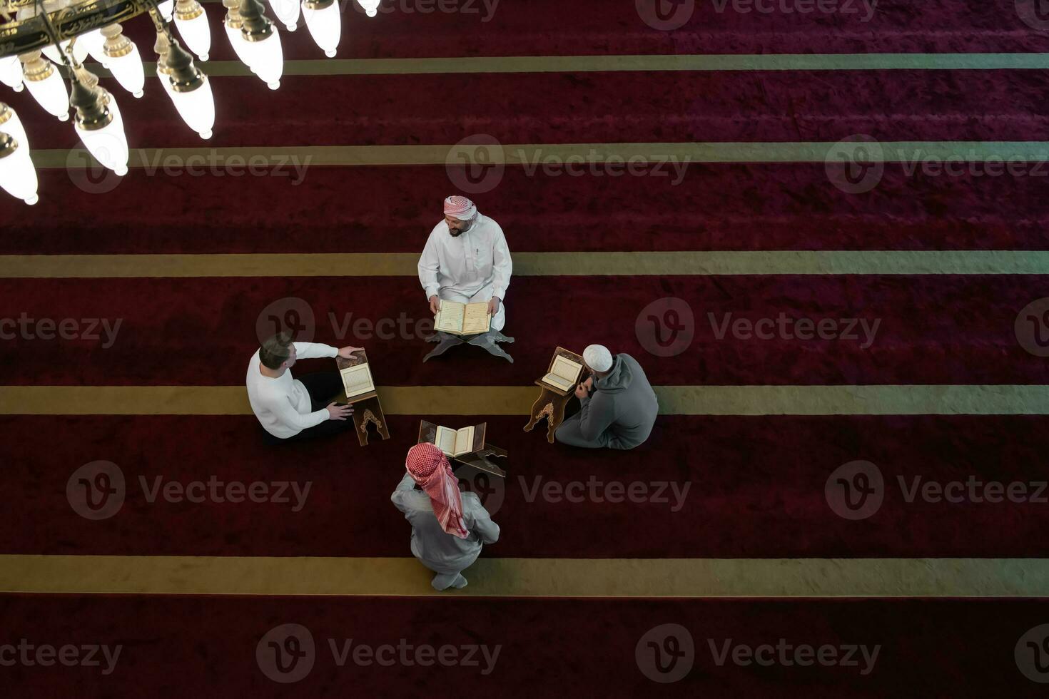 muslim people in mosque reading quran together photo