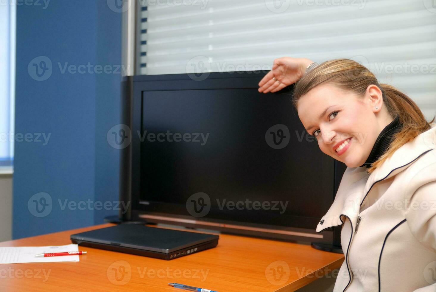 business woman pointing on screen photo