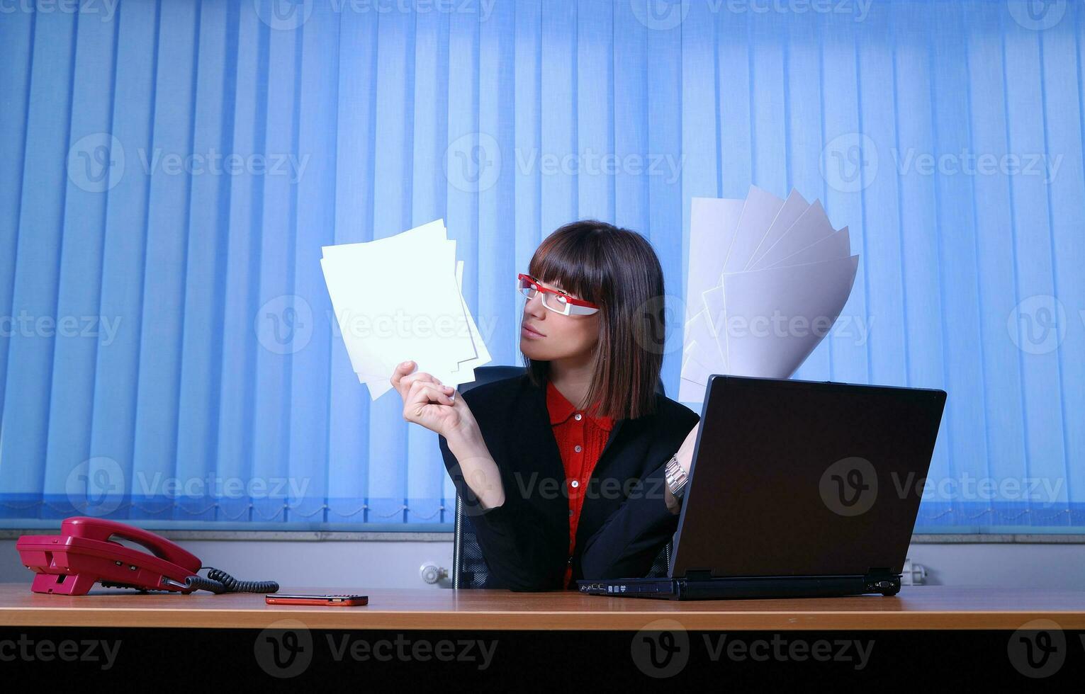 .angry businesswoman holding documents photo