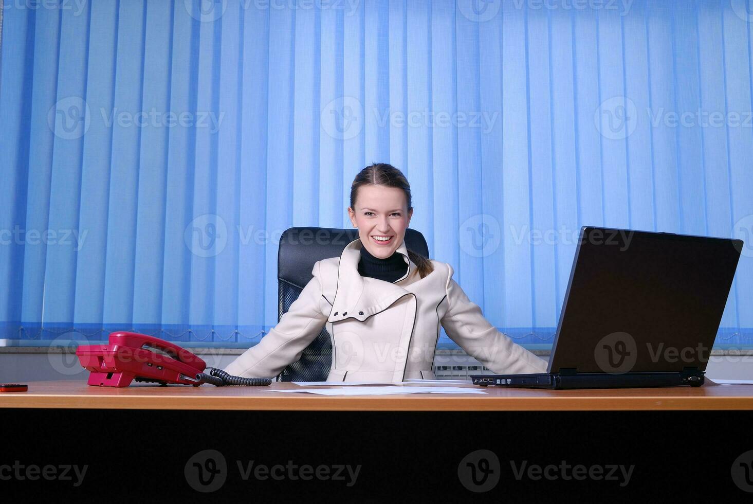 .happy businesswoman throwing papers in air photo