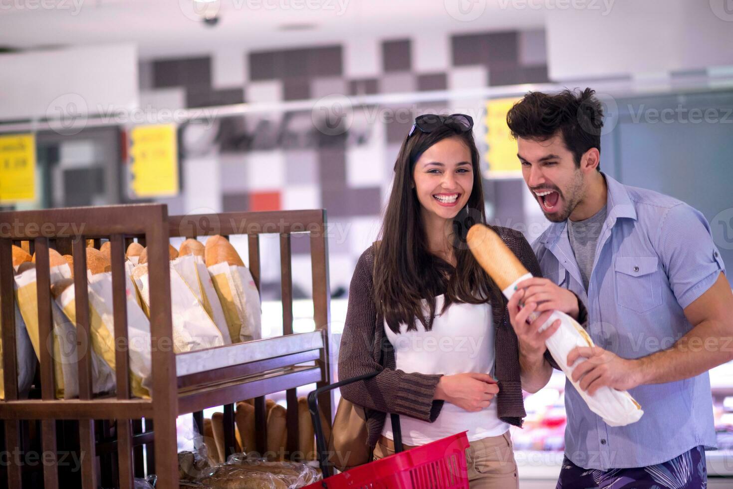 couple shopping in a supermarket photo
