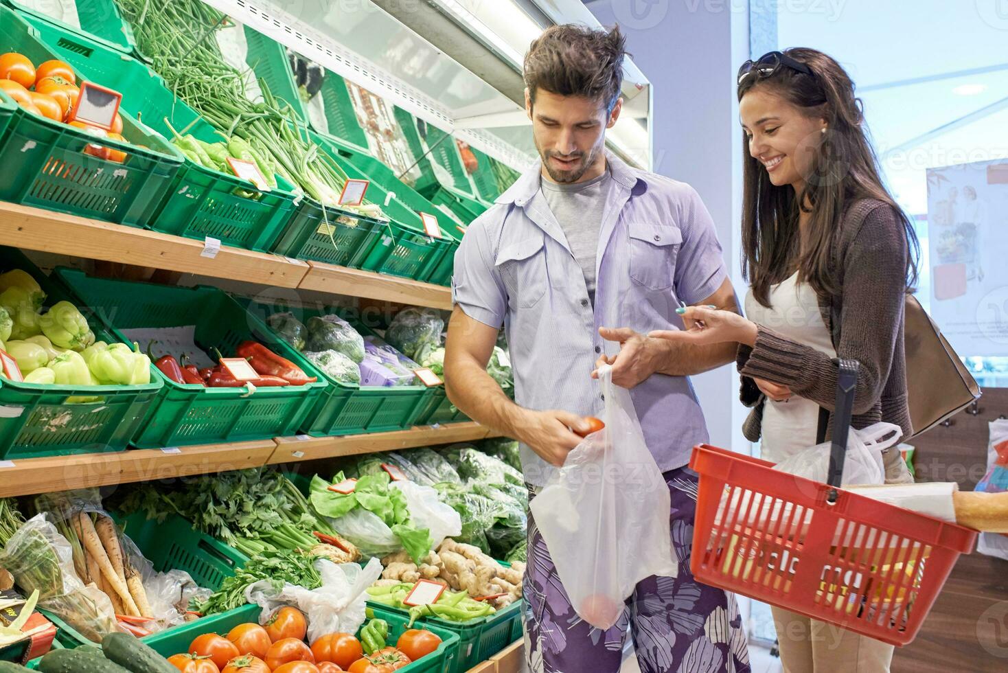 couple shopping in a supermarket photo