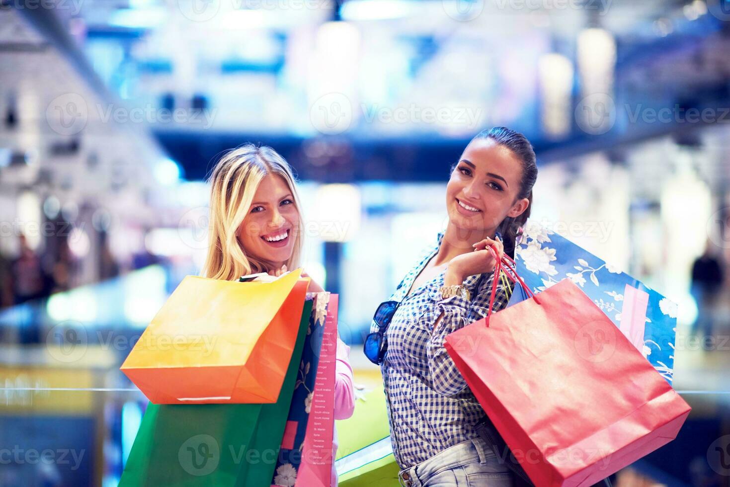 happy young girls in  shopping mall photo