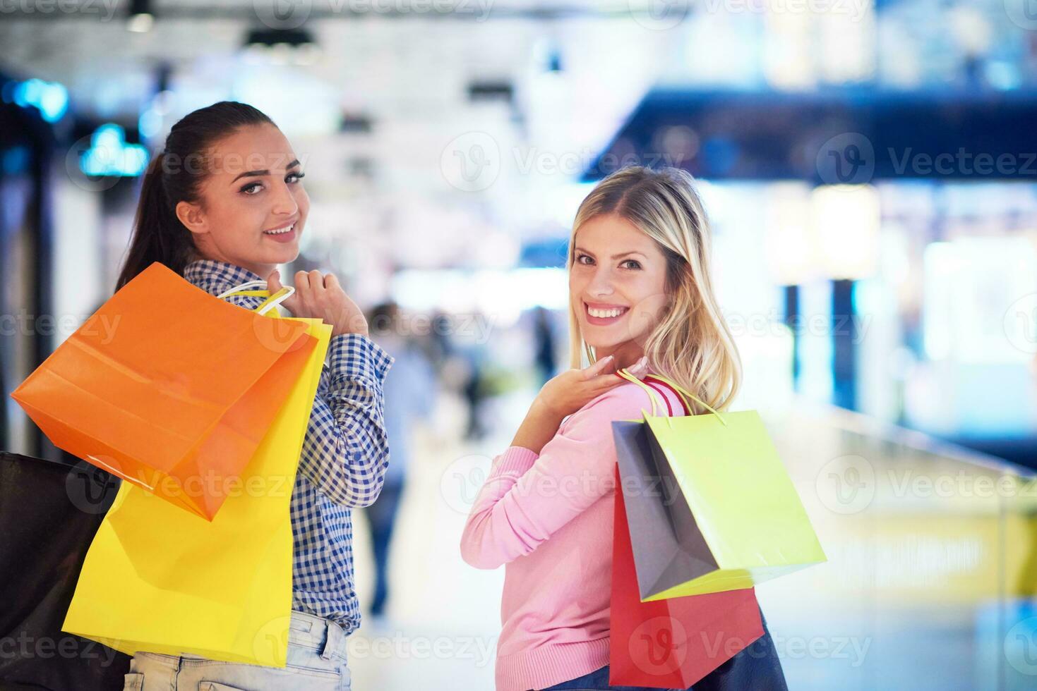 happy young girls in  shopping mall photo