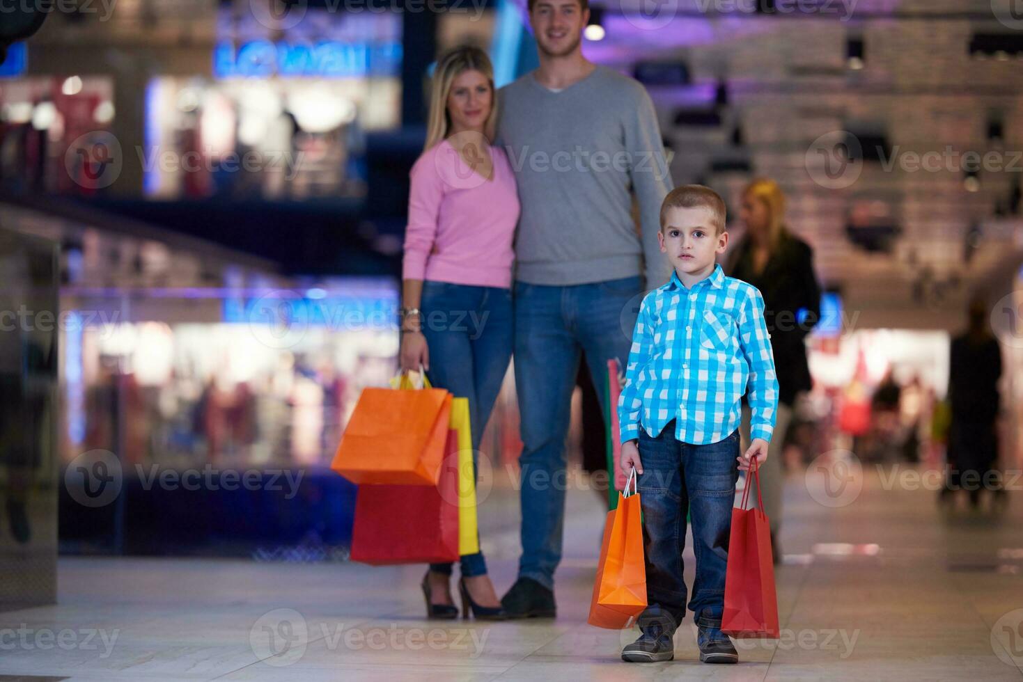 young family with shopping bags photo