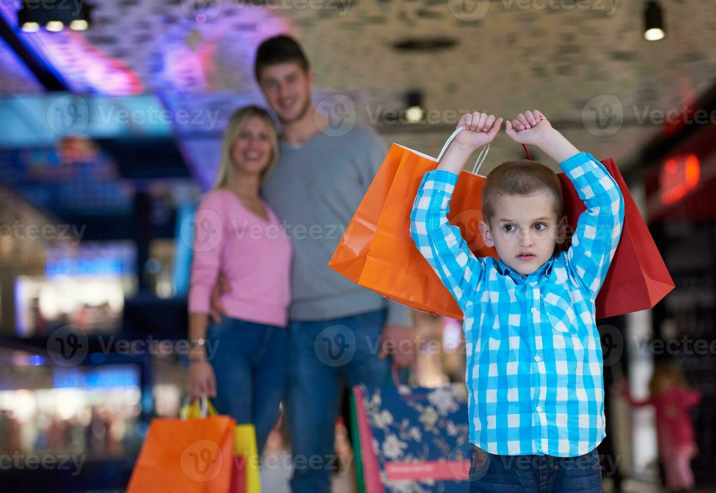 young family with shopping bags photo