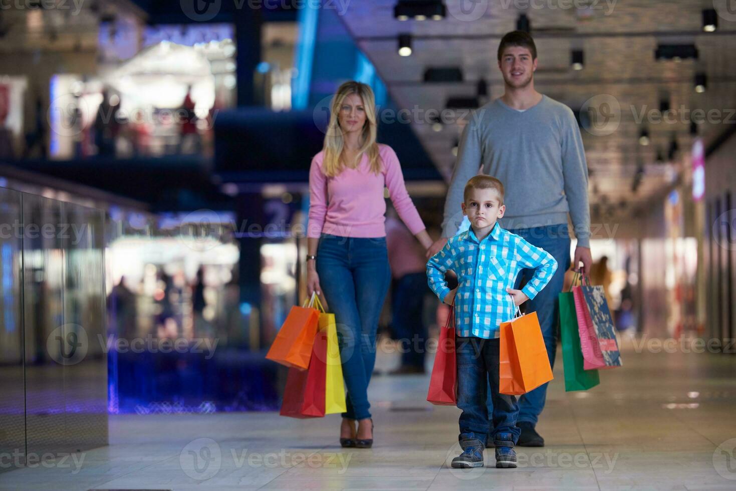 young family with shopping bags photo