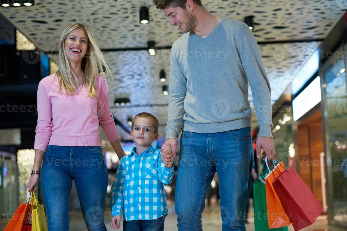 young family with shopping bags photo