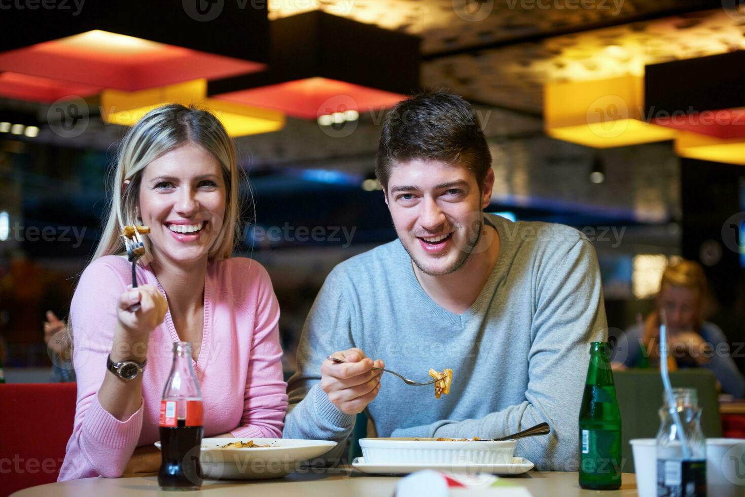 couple having lunch break in shopping mall photo