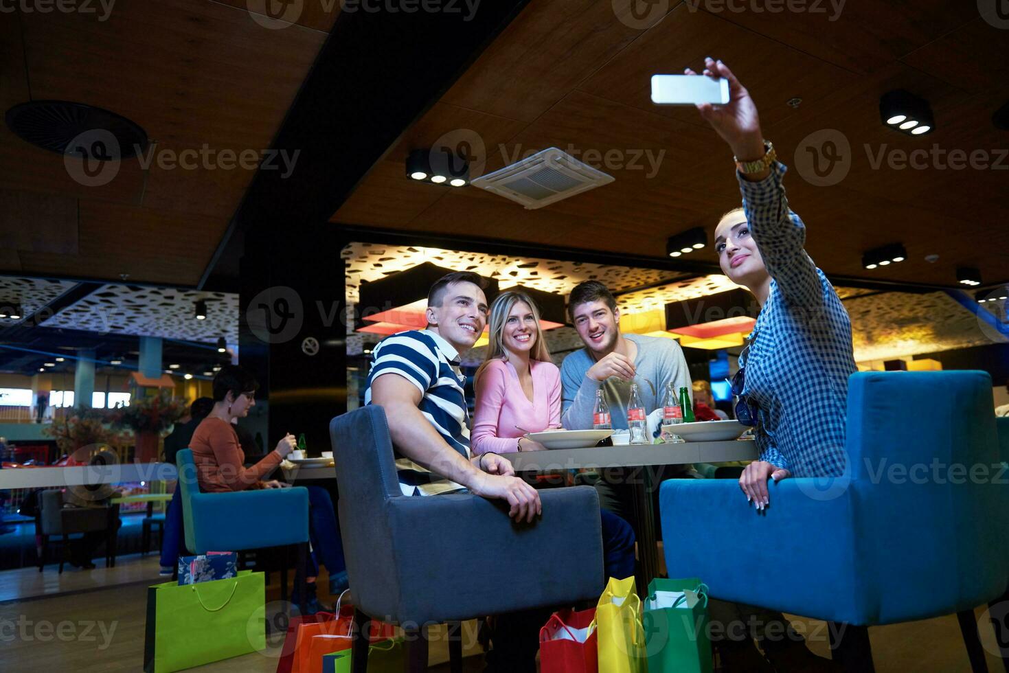 friends have lanch break in shopping mall photo