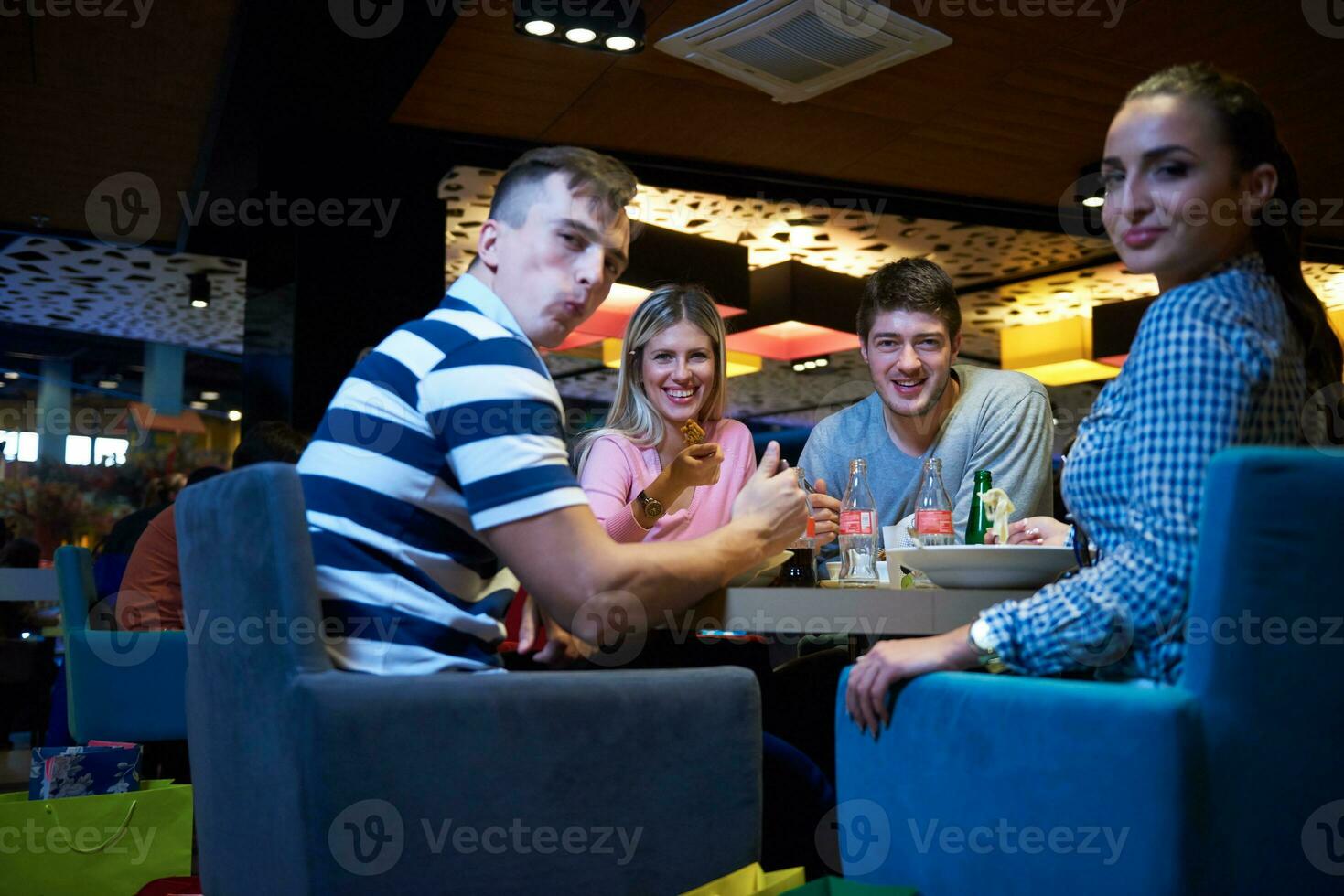 friends have lanch break in shopping mall photo