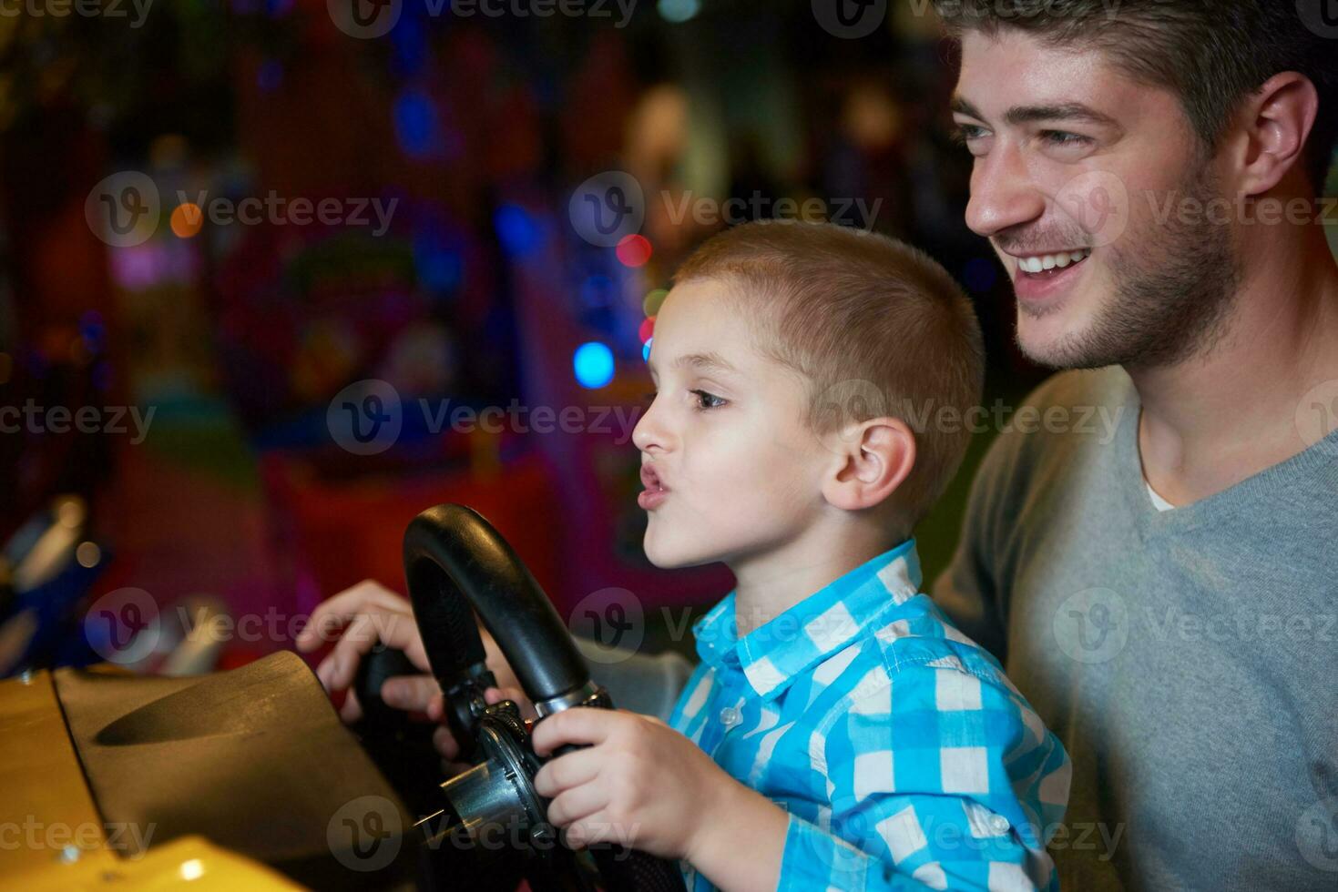 father and son playing game in playground photo