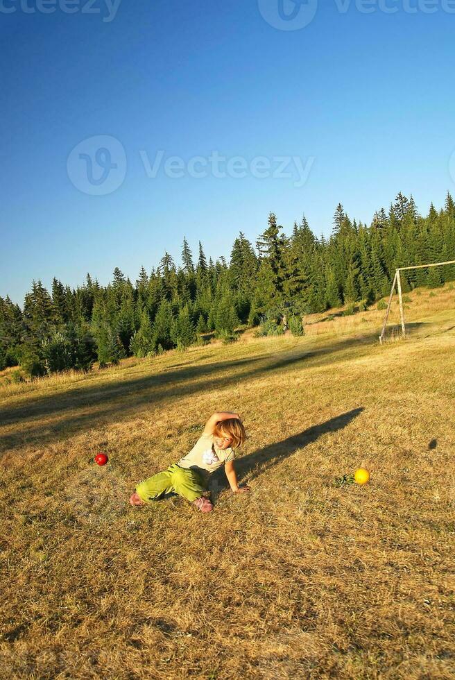 happy girl throwing apple outside photo
