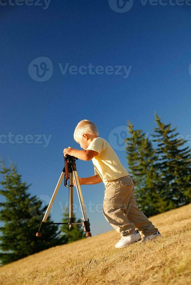 little boy with tripod photo