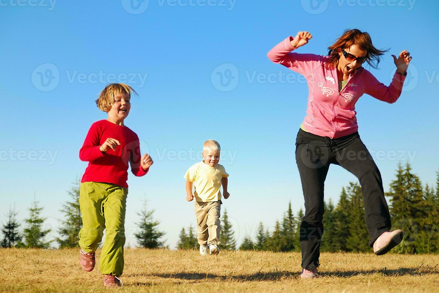 mother and kids having fun outside photo