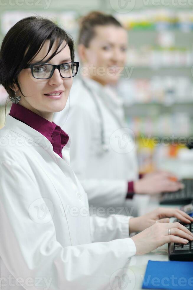 team of pharmacist chemist woman  in pharmacy drugstore photo