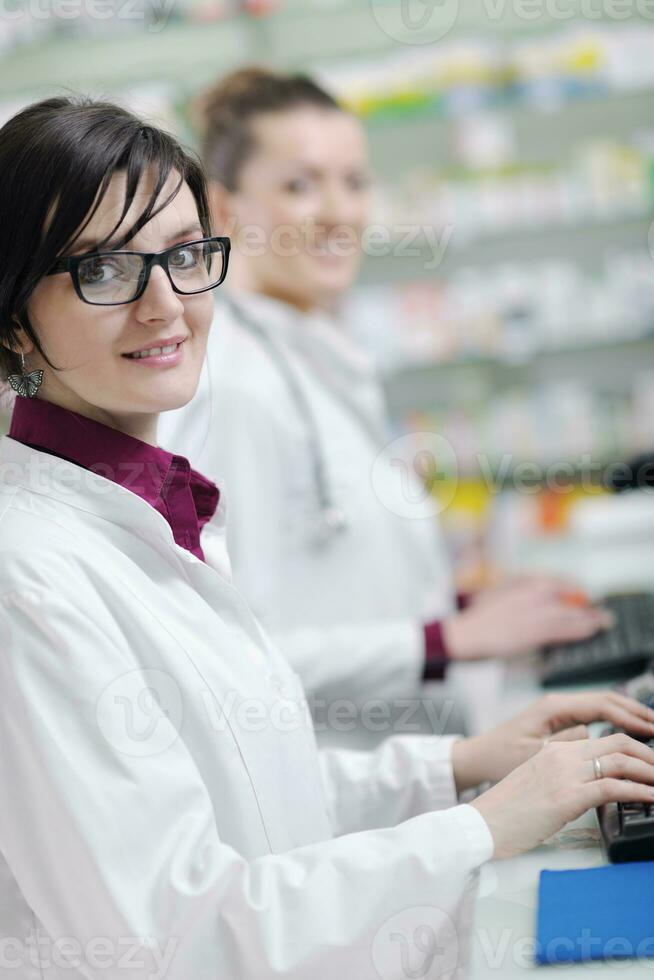 team of pharmacist chemist woman  in pharmacy drugstore photo