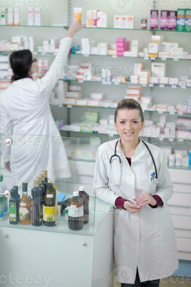 team of pharmacist chemist woman  in pharmacy drugstore photo