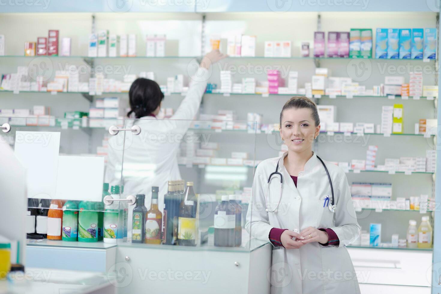 team of pharmacist chemist woman  in pharmacy drugstore photo