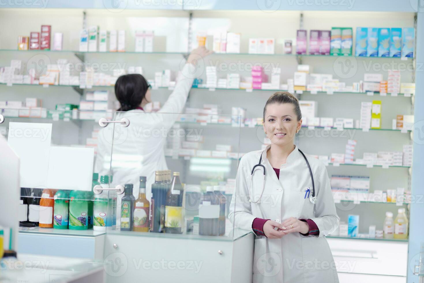 team of pharmacist chemist woman  in pharmacy drugstore photo