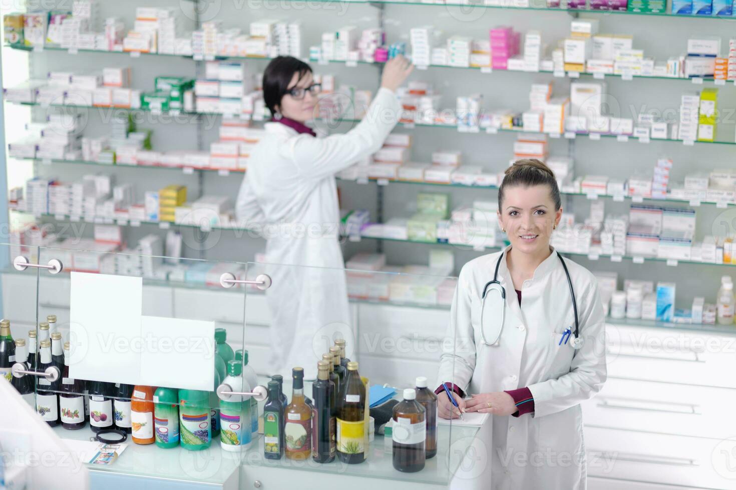 team of pharmacist chemist woman  in pharmacy drugstore photo