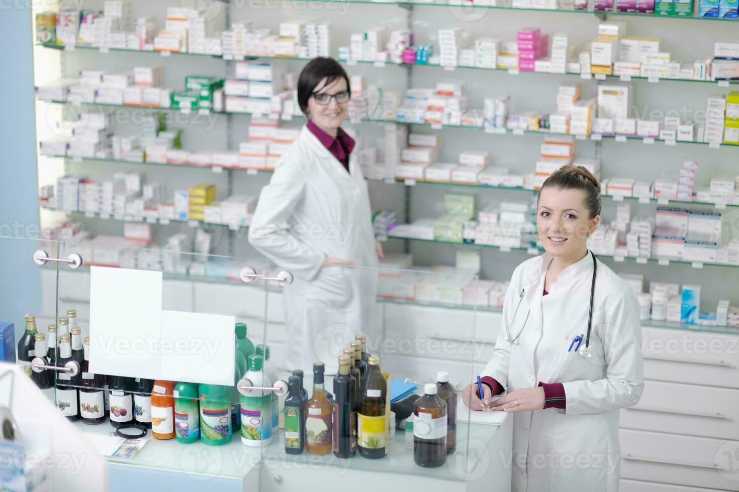 team of pharmacist chemist woman  in pharmacy drugstore photo