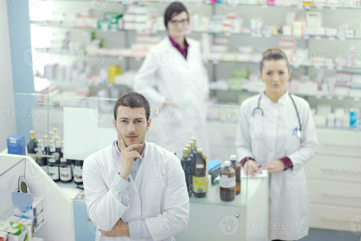 team of pharmacist chemist woman  in pharmacy drugstore photo